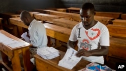 Election volunteers count ballots at a polling station in Rwanda's capital Kigali Aug. 3, 2017, in preparation for the presidential election on Friday.