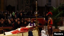 Faithful pay homage to former Pope Benedict in St. Peter's Basilica at the Vatican