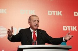 Turkey's President Recep Tayyip Erdogan addresses the World Turkish Business Council meeting, in Baku, Azerbaijan, Monday. Oct. 14, 2019.