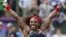 Serena Williams of the U.S. celebrates after winning the women's singles gold medal match against Russia's Maria Sharapova at the All England Lawn Tennis Club during the London 2012 Olympic Games August 4, 2012.