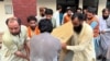 People carry the coffin of former Senator Hidayatullah Khan after he was killed in a bomb explosion in the Bajaur district of Pakistan's Khyber Pakhtunkhwa province on July 3, 2024.