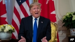 President Donald Trump speaks during a meeting with Canadian Prime Minister Justin Trudeau at Winfield House during the NATO summit, Dec. 3, 2019, in London. 