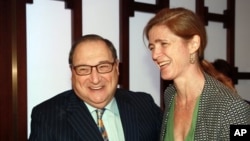 In this photo provided by the Anti-Defamation League, ADL National Director Abraham Foxman, welcomes Samantha Power, US Ambassador to United Nations, at the ADL Annual Meeting in New York, Thursday, Oct. 31, 2013. Power addressed the meeting as the organi