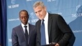 Actors George Clooney, right, and Don Cheadle, left, arrive for a press conference to discuss an investigation about corruption in South Sudan at the National Press Club in Washington, D.C. Sept. 12, 2016.