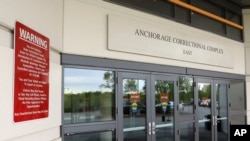 The public entrance to the Anchorage Correctional Complex, May 23, 2018, in Anchorage, Alaska. Muslim inmates won a settlement against state corrections officials they said weren't providing them with inadequate nourishment as they break their fasts.