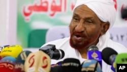 FILE - Former Sudanese Prime Minister Sadiq al-Mahdi speaks during a news conference in Khartoum, Feb. 6, 2020. On Oct. 22, al-Mahdi threatened to pull the support of his Umma Party from the government if it went ahead with normalizing ties with Israel.