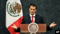 FILE - Mexico's President Enrique Pena Nieto gives an address in response to the U.S. presidential election in Mexico City.