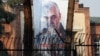 A picture of Iranian Major General Qassem Soleimani, head of the elite Quds Force, who was killed in an airstrike at Baghdad airport, is seen on the former U.S. Embassy's building in Tehran, Iran, Jan. 7, 2020.