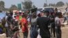 People are seen at a busy market near Harare on Nov. 15, 2021. (AP Photo/Tsvangirayi Mukwazhi)