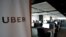 FILE - Employees work inside Uber's Center of Excellence office in Cairo, Egypt, Oct. 10, 2017. 