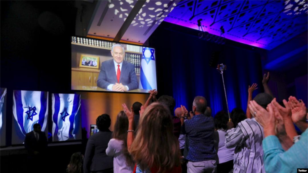 Perdana Menteri Israel Benjamin Netanyahu menyampaikan sambutan untuk para peserta konferensi Kristen untuk Israel di Washington, D.C., melalui tautan video, 23 Juli 2018.