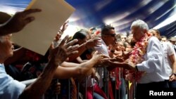 Mexico's President-elect Andres Manuel Lopez Obrador arrives at a rally as part of a tour to thank supporters for his landslide victory in the July 1 election, in Juchitan de Zaragoza, Oaxaca state, Mexico, Sept. 19, 2018. 