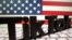 FILE:: A 3D printed Tik Tok logo is placed on a keyboard in front of U.S. flag in this illustration taken October 6, 2020.
