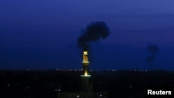 Smoke rises following an Israeli strike, in Gaza May 10, 2023. 