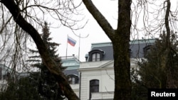 FILE PHOTO: A national flag of Russia flies on the Russian embassy in Prague, Czech Republic, March 26, 2018. REUTERS/David W Cerny/File Photo