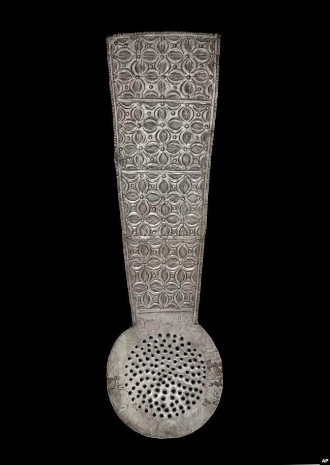 FILE - In this photo provided by the Victoria and Albert Museum, London January 25, 2024 a view of a silver spoon with repoussé and punched decoration and a broad flat handle, originating from Ghana.