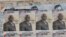 FILE - Election posters for opposition candidate Ayah Paul Abine of the People Action Party are pasted on a wall in the capital Yaounde, Cameroon, Oct. 7, 2011. 