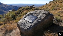 One of the plaques honoring each of the fallen 19 Granite Mountain Hotshots along a 3.5 mile trail to a memorial where the firefighters died is part of a Granite Mountain Hotshots Memorial State Park, dedicated Nov. 29, 2016. A statue honoring the firefighters was unveiled Saturday.