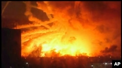 This photo provided by Ukrainian Emergency Situations Ministry press service shows a fire raging at a military ammunition depot in Balaklia near Khrakiv in Ukraine, March 23 2017. 