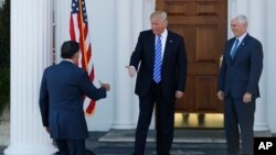 President-elect Donald Trump, center, and Vice President-elect Mike Pence, greet Mitt Romney, left, as he arrives at Trump National Golf Club Bedminster, New Jersey, Nov. 19, 2016. Romney was among the top candidates already interviewed for secretary of state.