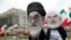 FILE - Protesters yell behind effigies of Iranian President Hassan Rouhani and Supreme Leader Ayatollah Ali Khamenei to rally for government change in Iran during a demonstration in Washington, March 8, 2019.