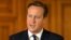 Britain's Prime Minister David Cameron makes a statement to the media following the killing of Scottish aid worker David Haines, at Number 10 Downing Street in London, Sept. 14, 2014.