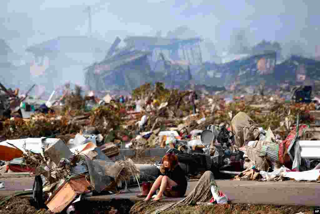 A woman cries in the destroyed city of Natori, Miyagi Prefecture, northern Japan, March 13, 2011. (Reuters)