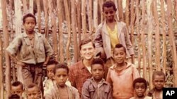 Michael MicCaskey surrounded by children from the town of Fetche, Ethiopia where he served in the Peace Corps (1965)