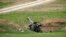 Armenian soldiers aim a howitzer, April 3, 2016, in the village of Mardakert, in the separatist region of Nagorno-Karabakh.