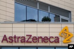 A general view of AstraZeneca offices and the corporate logo in Cambridge, England, July 18, 2020.