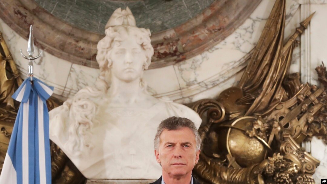 FILE - In this handout picture provided by Argentina Presidency, Argentina President Mauricio Macri pauses during a message to the nation at Government House in Buenos Aires, May 9, 2019.