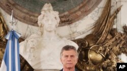 FILE - In this handout picture provided by Argentina Presidency, Argentina President Mauricio Macri pauses during a message to the nation at Government House in Buenos Aires, May 9, 2019.