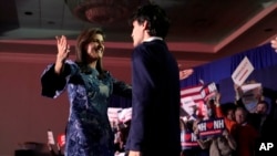 FILE - Republican presidential candidate former UN Ambassador Nikki Haley, left, hugs her son Nalin Haley at a New Hampshire primary night rally, in Concord, N.H., January. 23, 2024.