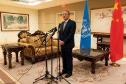 FILE - Chinese Ambassador to the United Nations Zhang Jun speaks to reporters at the Chinese Mission to the United Nations in New York, Sept. 22, 2020.