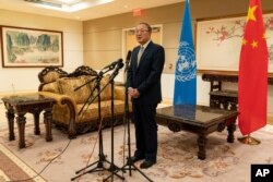 FILE - Chinese Ambassador to the United Nations Zhang Jun speaks to reporters at the Chinese Mission to the United Nations in New York, Sept. 22, 2020.