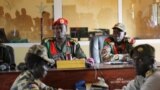 FILE - Judges sit in the courtroom during a trial at a court in the capital Juba, South Sudan, May 30, 2017. The country has announced plans to create a hybrid court to deal with atrocities commited during its years of conflict. 