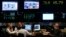 FILE - Argentine stockbrokers work on the floor of the Buenos Aires Stock Exchange June 16, 2014.