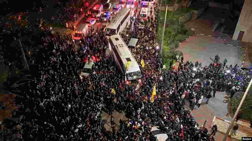 A drone view of people gathering during the arrival of the freed Palestinian prisoners, after they were released from an Israeli jail as part of a hostages-prisoners swap and a ceasefire deal in Gaza between Hamas and Israel, in Ramallah, in the Israeli-occupied West Bank.