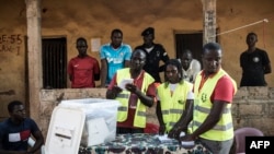 Election officials start counting votes at a polling station in the Bairro Militar area of the capital Bissau, in Guinea-Bissau, Nov. 24, 2019.