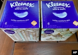 Two boxes of Kleenex tissues are displayed in Ann Arbor, Mich., on Wednesday, May 25, 2022. (AP Photo/Dee-Ann Durbin)