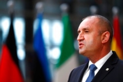 FILE - Bulgaria's President Rumen Radev speaks with the media as he arrives for an EU summit at the European Council building in Brussels, May 25, 2021.