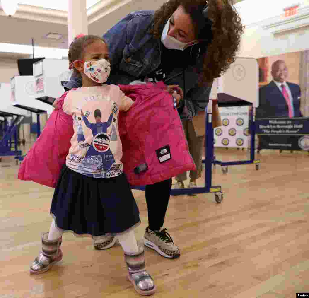 Zora King shows her &#39;future voter&#39; sticker at Borough Hall on the Election Day in Brooklyn, New York City, New York, Nov. 3, 2020. 