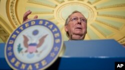 FILE - Senate Majority Leader Mitch McConnell of Kentucky speaks during a news conference on Capitol Hill in Washington, July 12, 2016. In the wake of the Florida school shooting on Feb. 14, 2018, McConnell so far has held back on bringing to the floor for debate and a vote a bill to strengthen a national background check system for gun ownership.