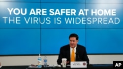 Arizona Republican Gov. Doug Ducey speaks about the latest coronavirus data at a news conference, June 25, 2020, in Phoenix.