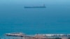 A picture taken from La Linea de la Concepcion in southern Spain shows supertanker Grace 1 suspected of carrying crude oil to Syria in violation of EU sanctions after it was detained in Gibraltar on July 4, 2019.