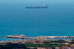 A picture taken from La Linea de la Concepcion in southern Spain shows supertanker Grace 1 suspected of carrying crude oil to Syria in violation of EU sanctions after it was detained in Gibraltar on July 4, 2019.