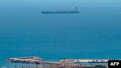 A picture taken from La Linea de la Concepcion in southern Spain shows supertanker Grace 1 suspected of carrying crude oil to Syria in violation of EU sanctions after it was detained in Gibraltar on July 4, 2019.