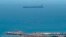 A picture taken from La Linea de la Concepcion in southern Spain shows supertanker Grace 1 suspected of carrying crude oil to Syria in violation of EU sanctions after it was detained in Gibraltar on July 4, 2019.