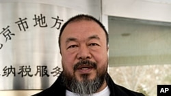 Chinese dissident artist Ai Weiwei shows his tax guarantee slips as he leaves the the Beijing Local Taxation Bureau, China. Ai went to the local tax bureau to fill in paperwork for a $1.3 million guarantee, and told reporters he feels like he was paying a