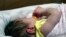 A week old baby lies in one of the ICU bays at one of the Norton Children's Hospital neonatal intensive care units, Feb. 13, 2018, in Louisville, Kentucky. This NICU is dedicated to newborns of opioid addicted mothers, that are suffering with newborn abst